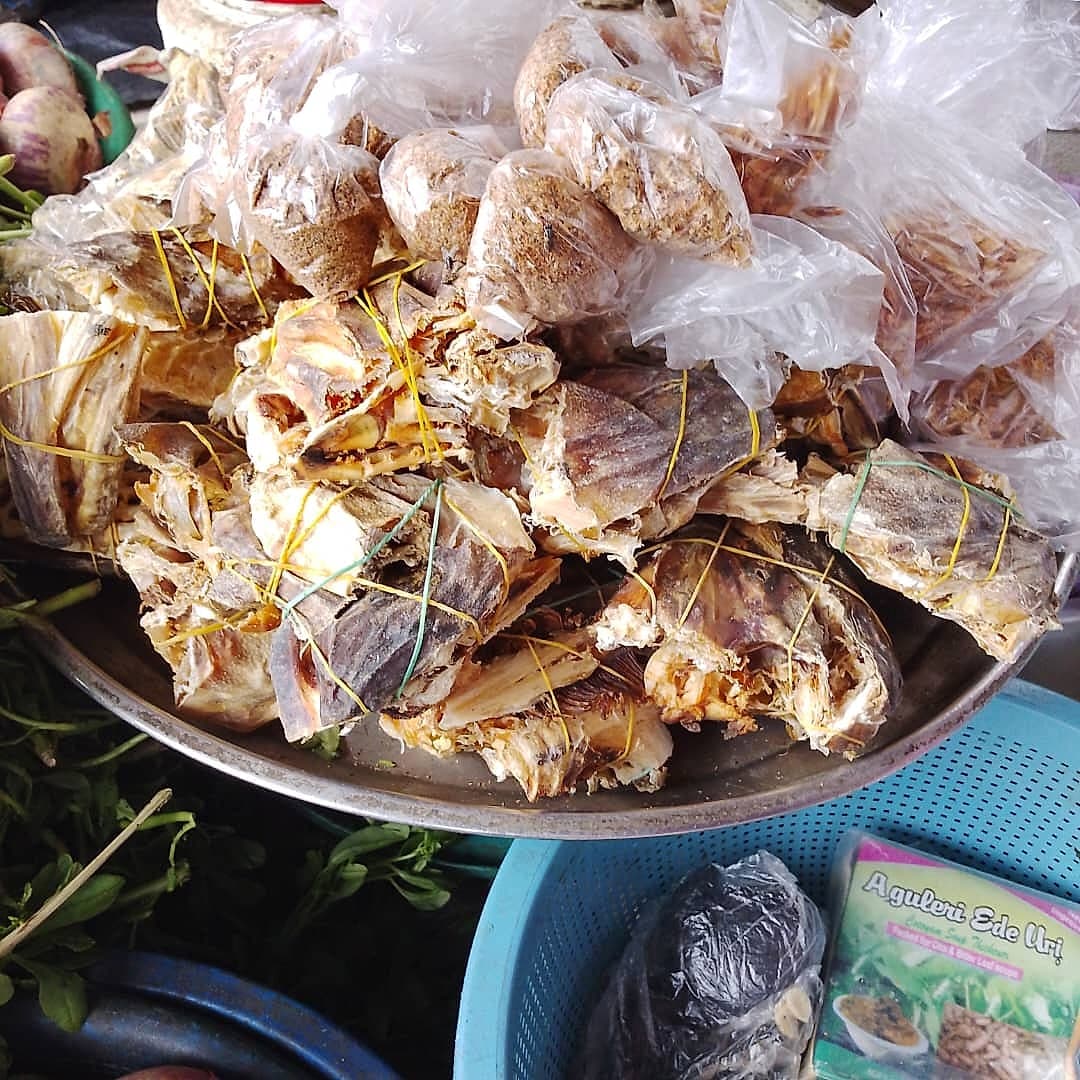 Bundled dried fish alongside bags of ground crayfish