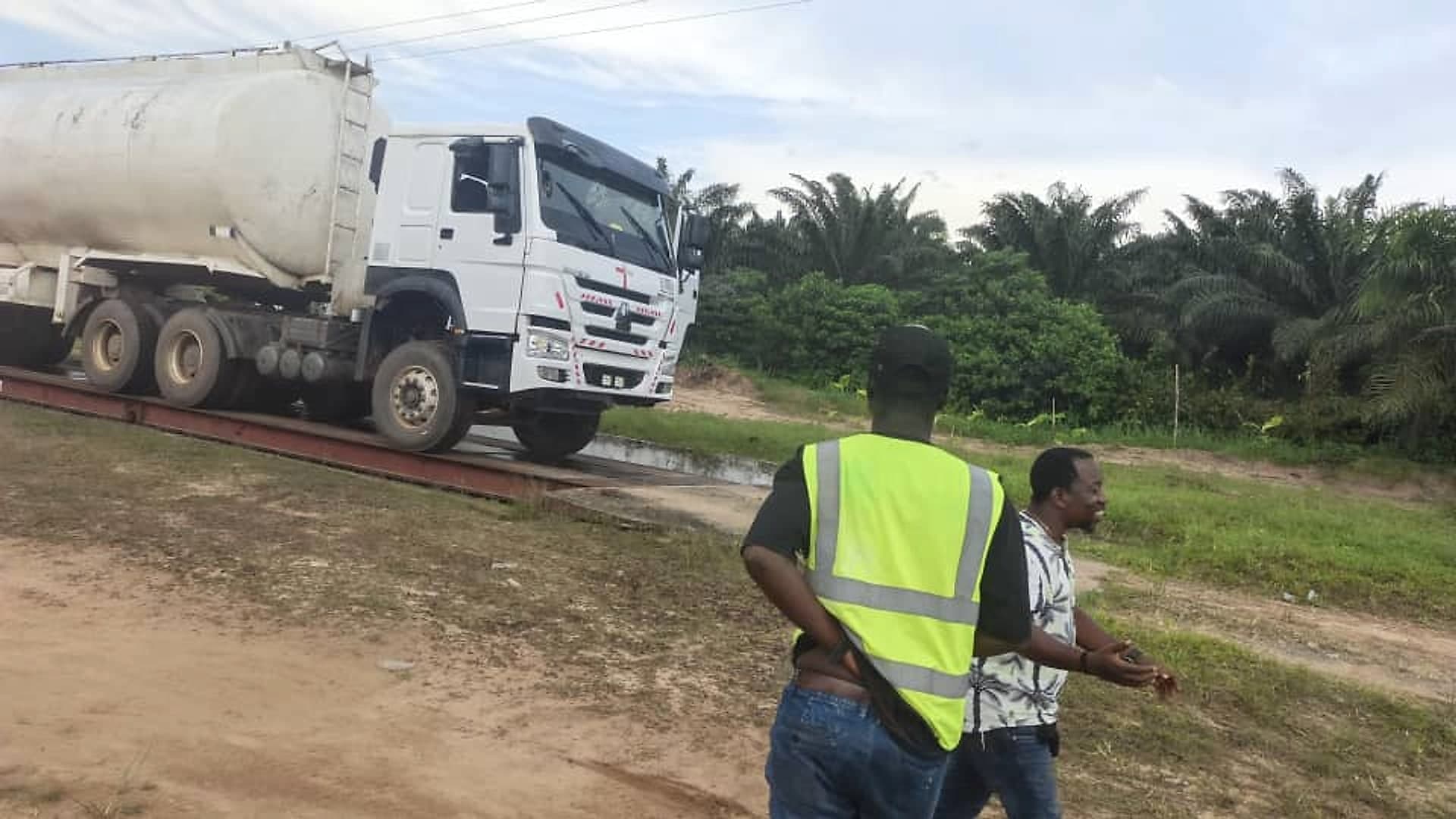 Team members beside a tanker on the weighbridge